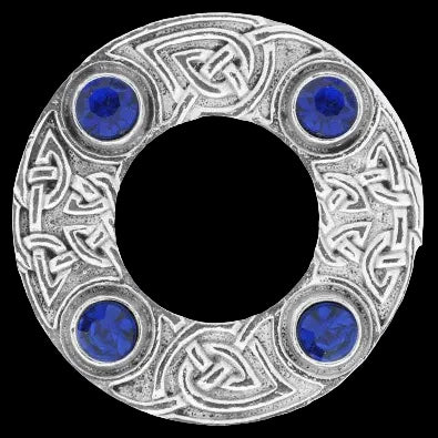 Decorative silver ring with blue gemstones on a white background